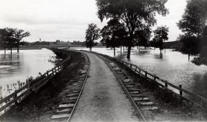 Dinkey tracks between Ames and campus with flood waters, undated.